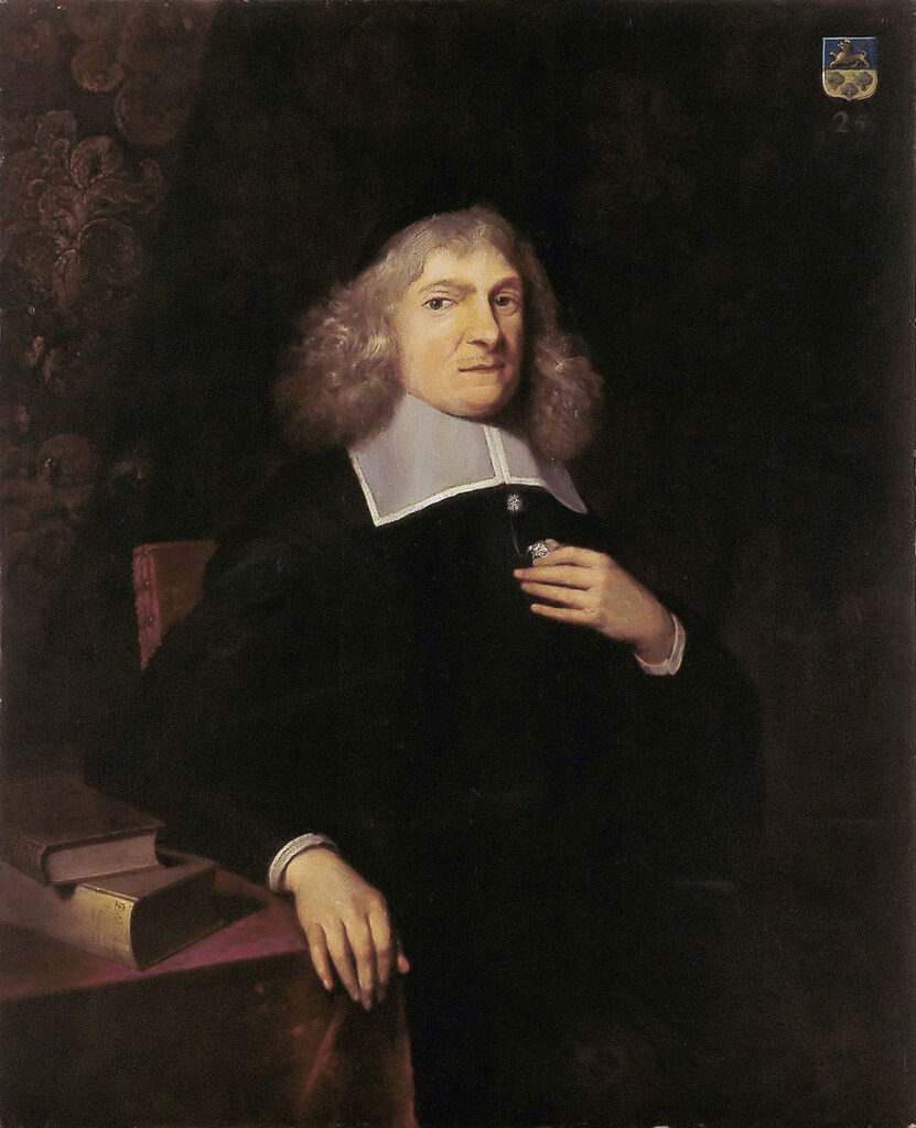 Portret van Abraham de Wicquefort gezeten, driekwart naar rechts. Een man helemaal in het zwart, met een witte vierkante kraag. Grijzige krullen tot op de schouders en priemende ogen richting de kijker. Zijn rechterhand rust op een tafeltje met twee boeken, zijn linkerhand heeft hij op de borst.