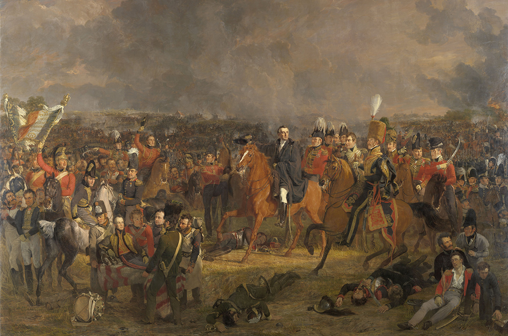 De slag bij Waterloo, 18 juni 1815. Gezicht op het slagveld op het moment dat de Engelse bevelhebber Wellington hoort dat Pruisische hulp onderweg is. De gewonde Willem, prins van Oranje, wordt links op de voorgrond weggevoerd. De bevelhebbers en andere officieren te paard staan in het midden, rechts op de voorgrond gewonde en dode soldaten. Op de achtergrond woeden de gevechten op het slagveld.