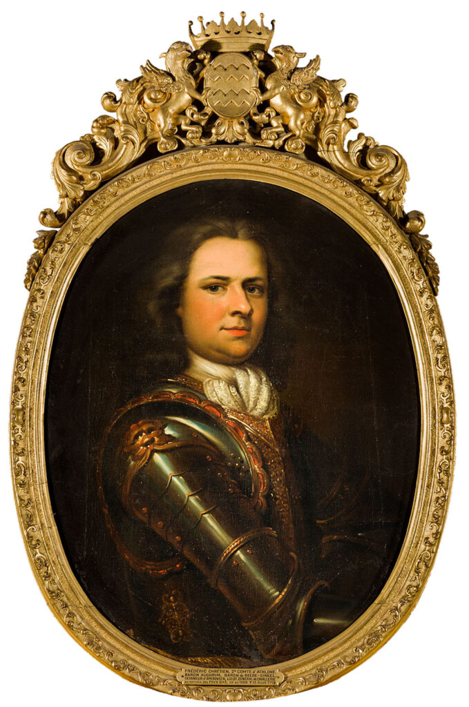 Halve lengte portret van een jonge man in uniform naar rechts gedraaid, die vol vertrouwen naar de kijker kijkt. Hij draagt een witte krawatte en een harnas dat versierd is met goud en rood. Het ovale schilderij zit in een gestoken gouden lijst met bovenop het van Reede wapen vastgehouden door twee griffioenen en gekroond met een Engelse graafskroon.