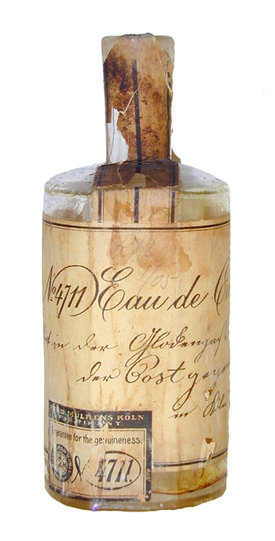 Een oud flesje met een vergeeld etiket met daarop (o.a.) in zwierige letters No. 4711 Eau de C...