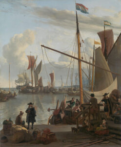 Het IJ voor Amsterdam, van de Mosselsteiger gezien. Op de kade wachten enkele reizigers. Verschillende grote boten en kleine schepen liggen in de haven.