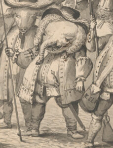 Tekening van een olifant als een dikke man in (Frans) uniform. Hij heeft een krullenpruik op met een grote hoed. Hij draagt een jas met grote manchetten, die open hangt. Om zijn middel een riem met daaraan een zwaard. In zijn rechterhand houdt hij een speer.